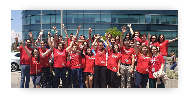 Colgate-Palmolive employees standing in front of Rome office building